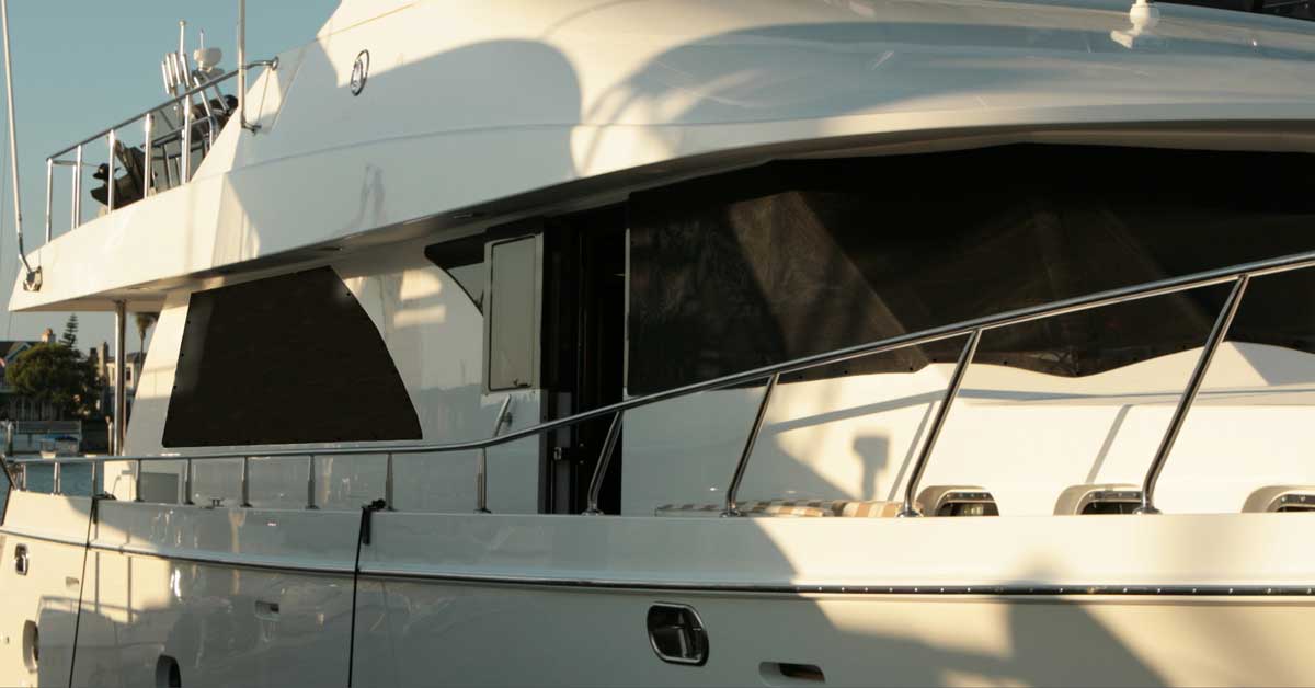 Yacht shades and boat blinds for daytime privacy in boat marina or yacht club moorage.